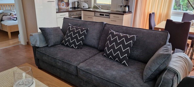 Modern vacation rental "Seestern 31" in Großenbrode. An exclusive vacation retreat with a sauna and bathtub. A sunny terrace for relaxing vacation moments. Fireplace, bike storage, and pets welcome in Großenbrode