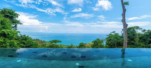 Wake up to the sounds of the jungle and dramatic views of the sea in Uvita